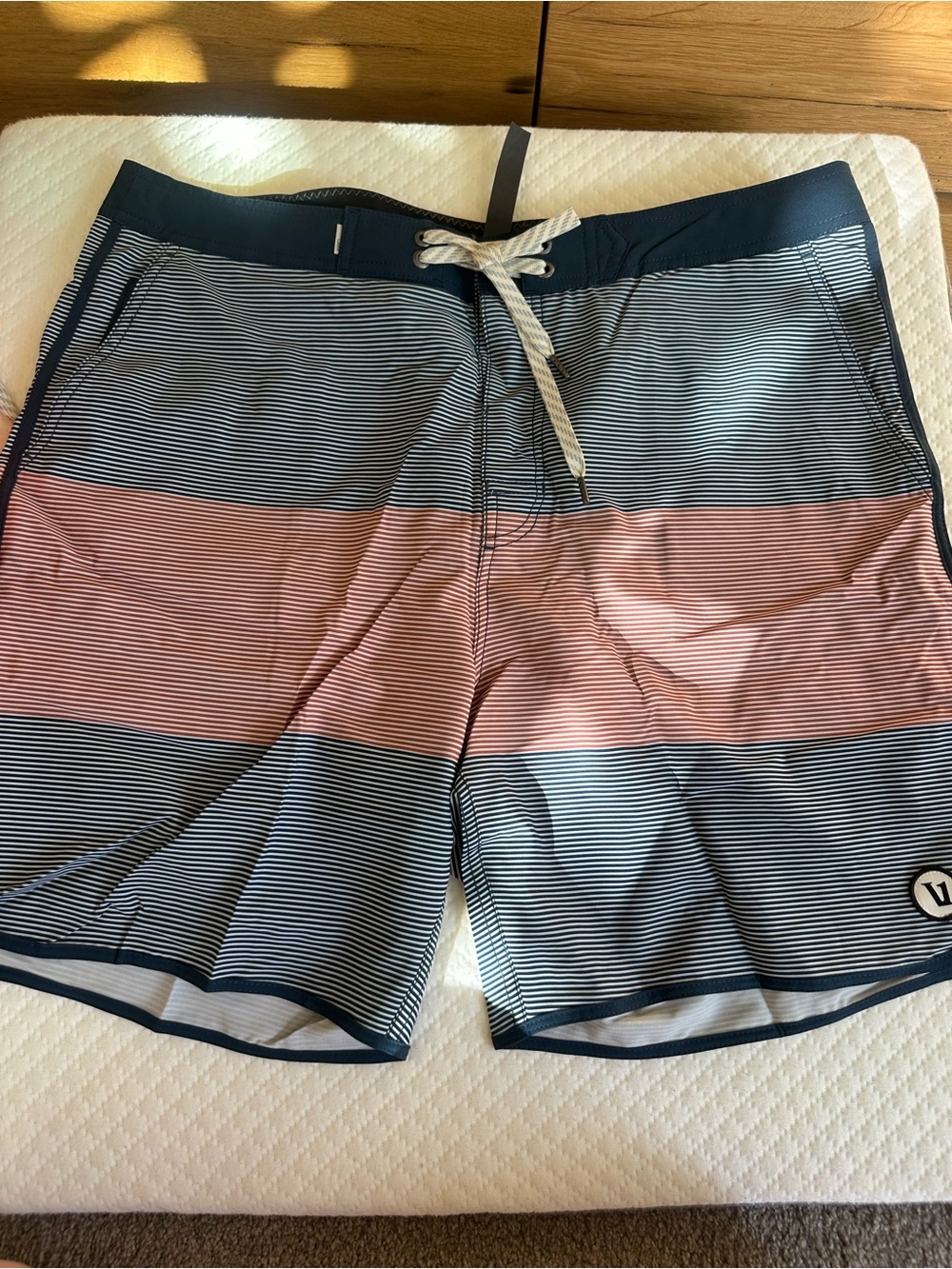 Vuori Navy and Coral Striped Swim Board Shorts